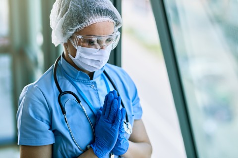 health-care worker praying