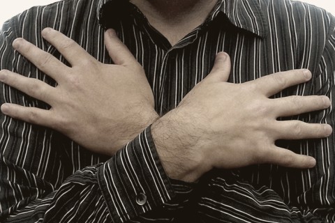 arms crossed over a person's chest