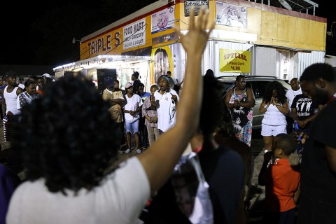 people gathered outside a store