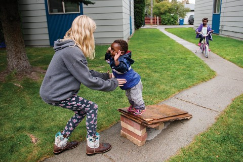 girl catching toddler