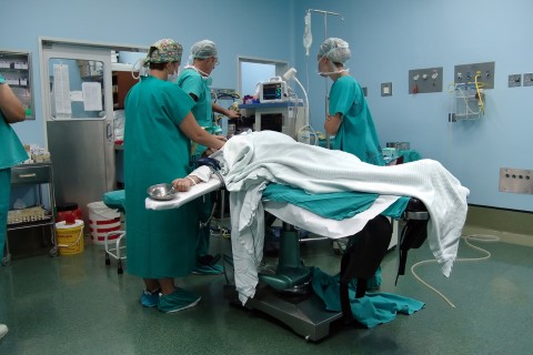a C-section underway in an operating room