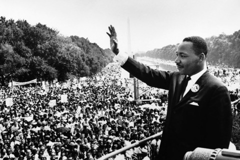 Martin Luther King waving to crowd