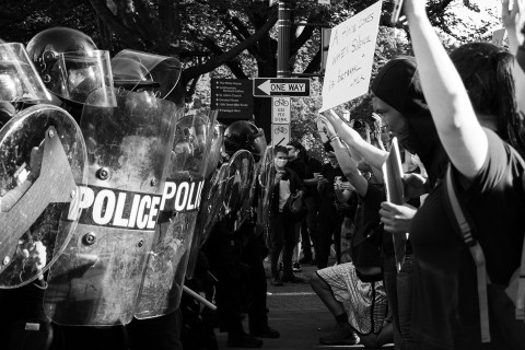 protesters face off with riot police