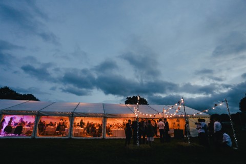 a wedding reception in a tent