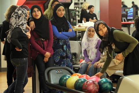 American Muslim teenagers bowling