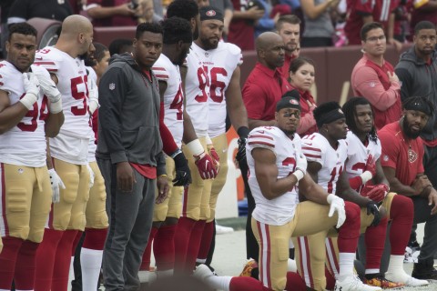 Football players kneeling