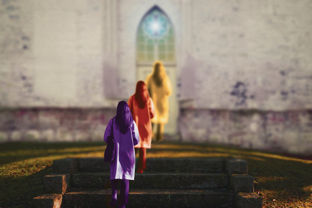 A woman approaches the door of a church