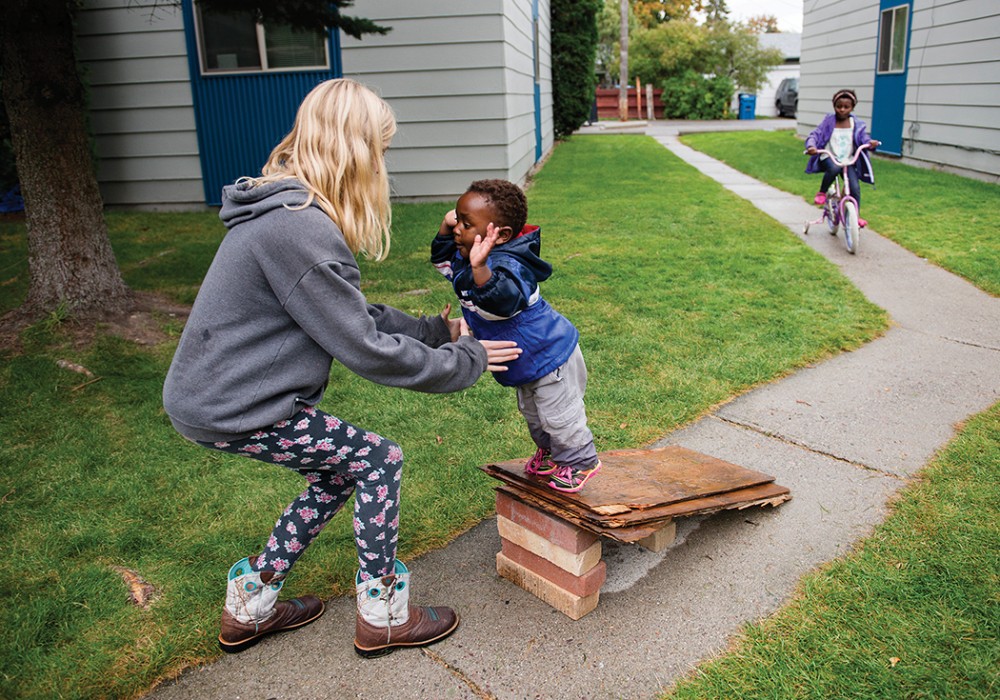 girl catching toddler