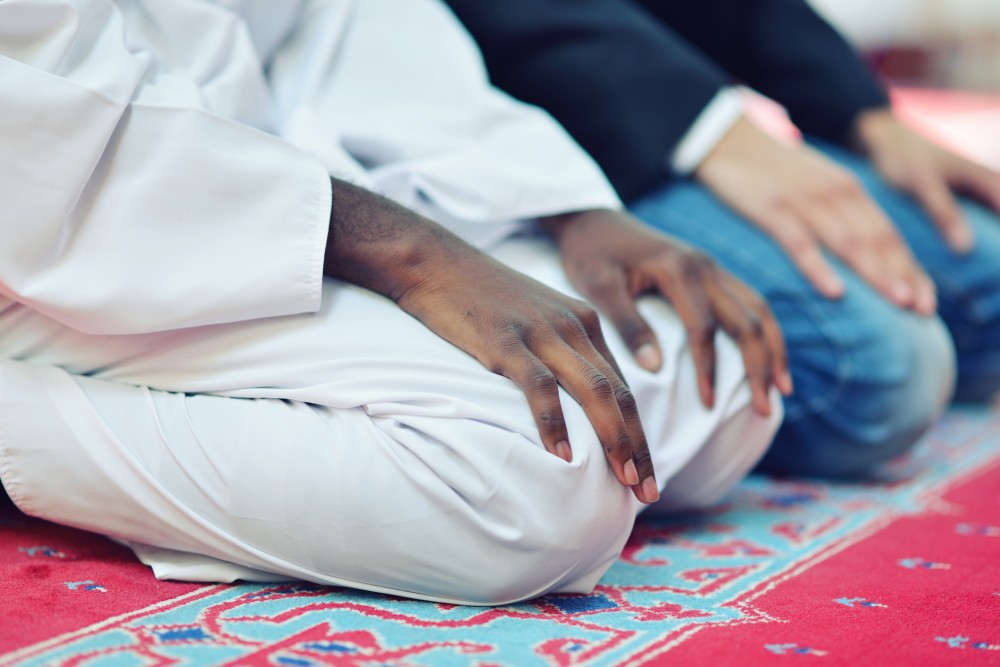 Muslim men praying