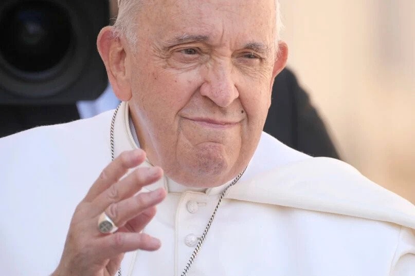 Pope Francis smile and waves while arriving at St. Peter's Square on April 22.