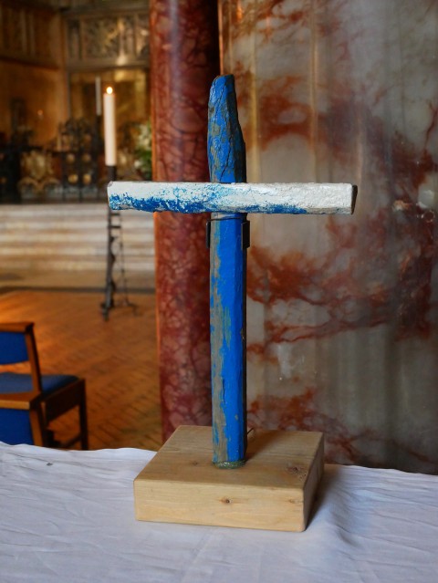 Blue Lampeduse Cross on an altar