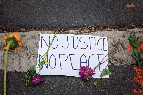 "No justice, no peace" sign