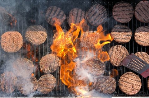 burgers on a fiery grill