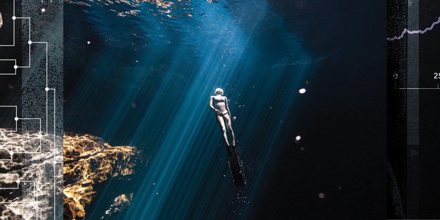 person floating to the surface of a big body of water