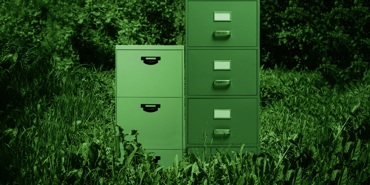 two green file cabinets in a green landscape