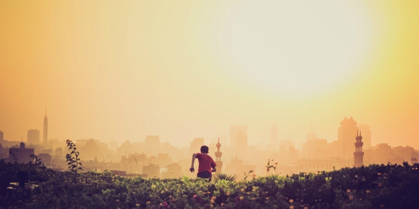 running toward bright city