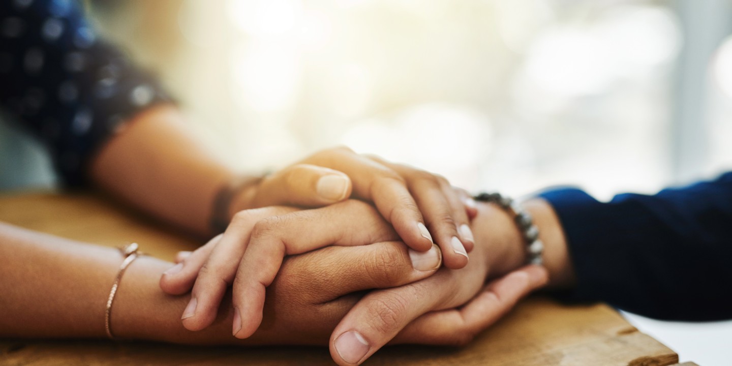 Friends holding hands