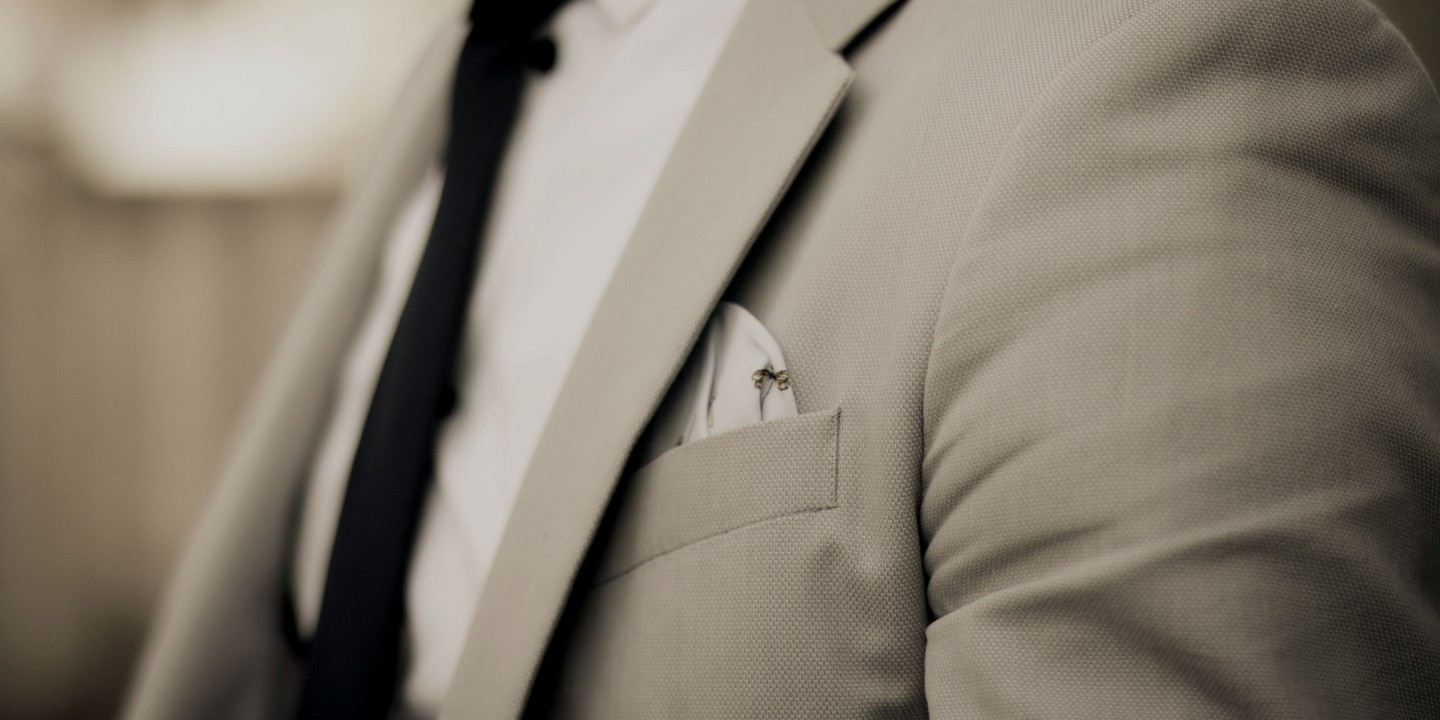 picture of torso of man in tidy suit