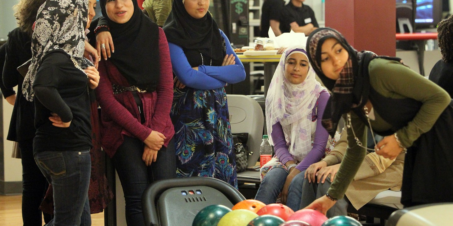 American Muslim teenagers bowling