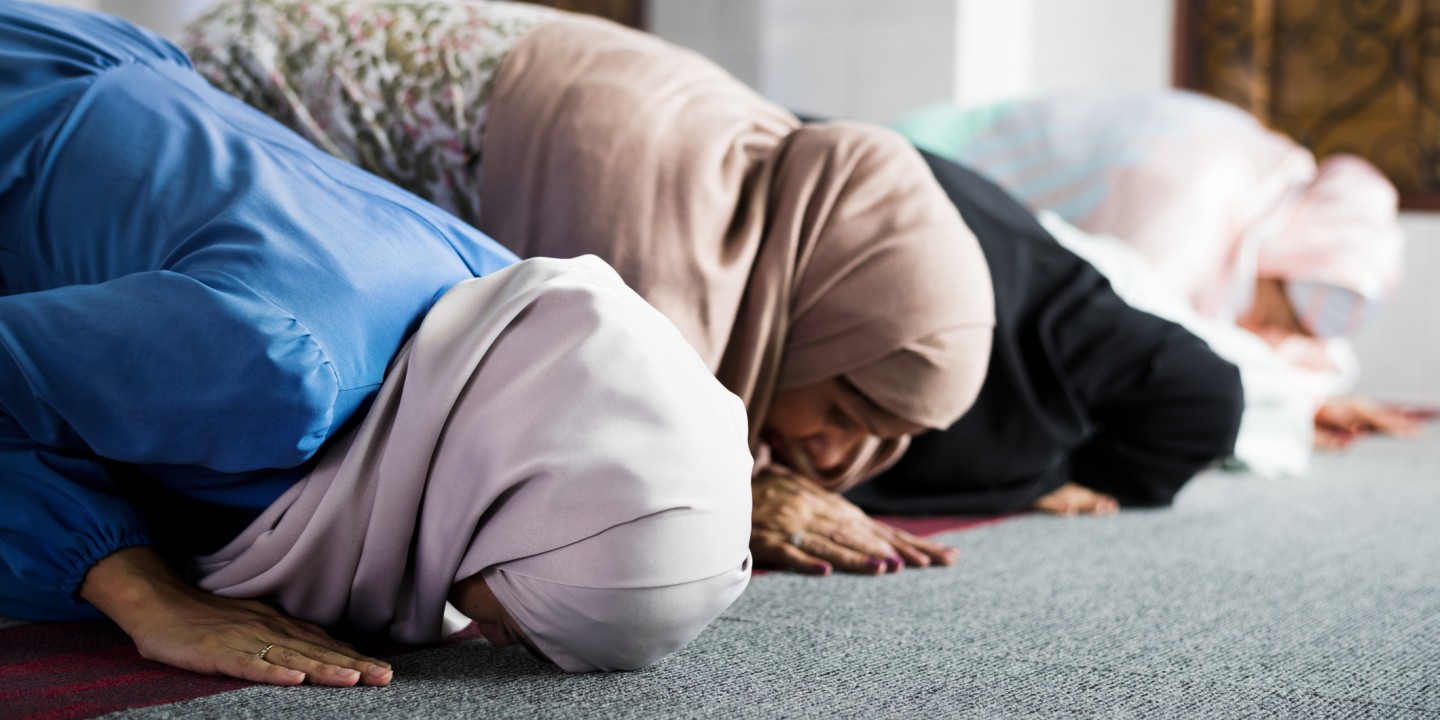 Muslim women praying in a mosque